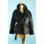 A ladies black mink and suede jacket, with mink collar, sleeves, back and front panels and suede