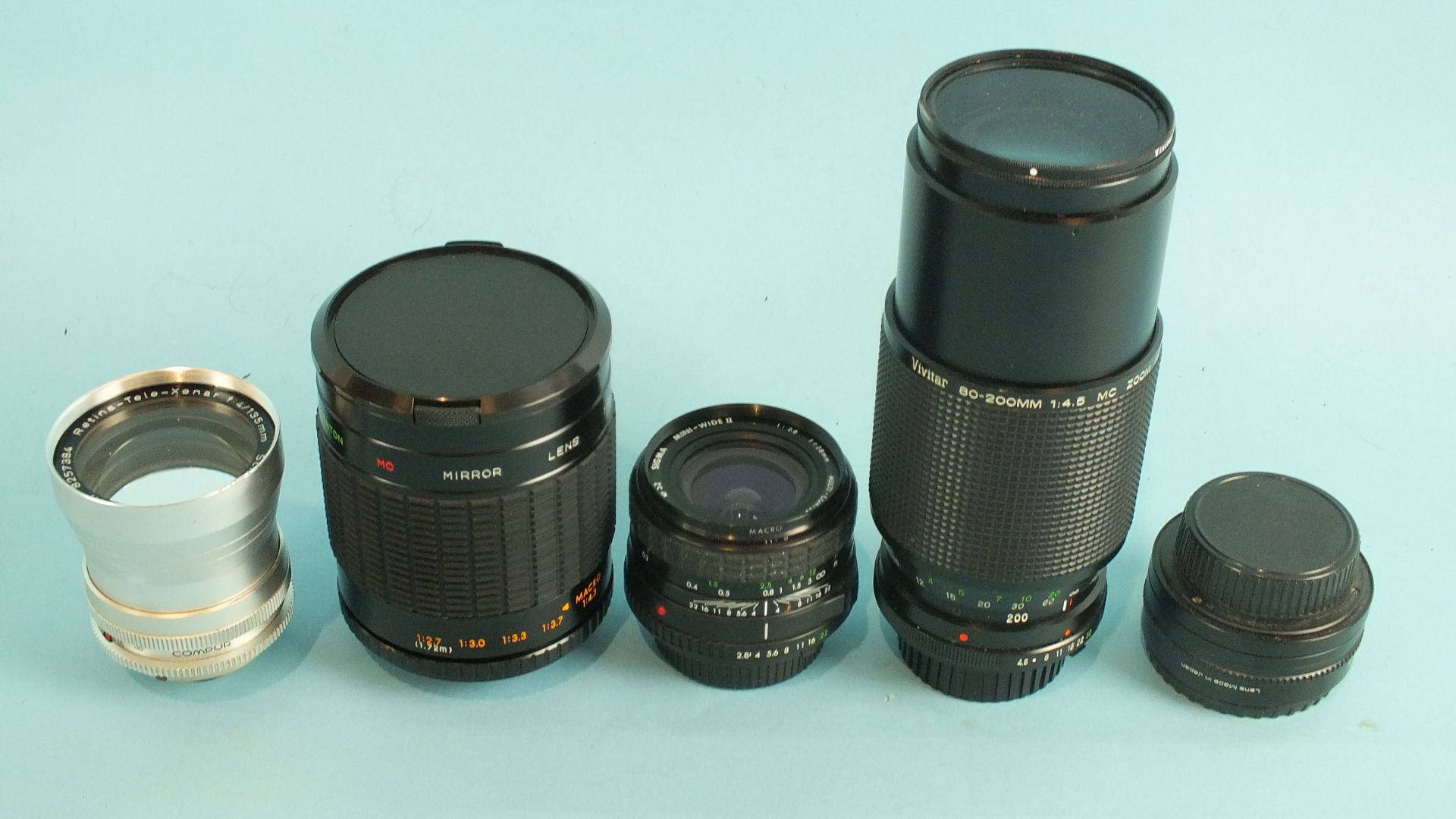 A Schneider-Kreuznach Retina-Tele-Xenar f:4/135mm lens, no.8257384, four other lenses, two digital