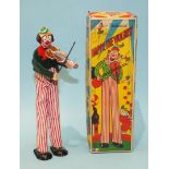 Happy the Violinist, a tinplate clockwork toy by TPS, Japan, with lithographed face, hands and