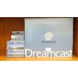 A boxed and unused Sega Dreamcast with Dreamcast Visual Memory 800-0009-50 Mk55 120-50 and six