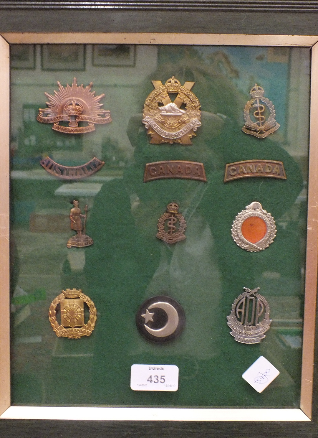 A collection of 117 various military badges contained in four glazed frames. - Image 4 of 4