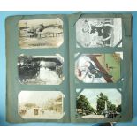 A quantity of postcards in an album and loose, including RPs of Portsmouth during a flood, heavy
