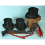 Three black silk top hats, one in leather box, a pair of ladies leather fashion boots with laced