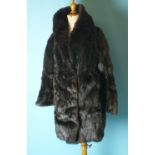 A dark brown musquash fur coat, a coney fur jacket and one other, acrylic jacket, (3).