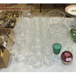 A collection of glassware, including wine and drinking glasses, bowls, etc.