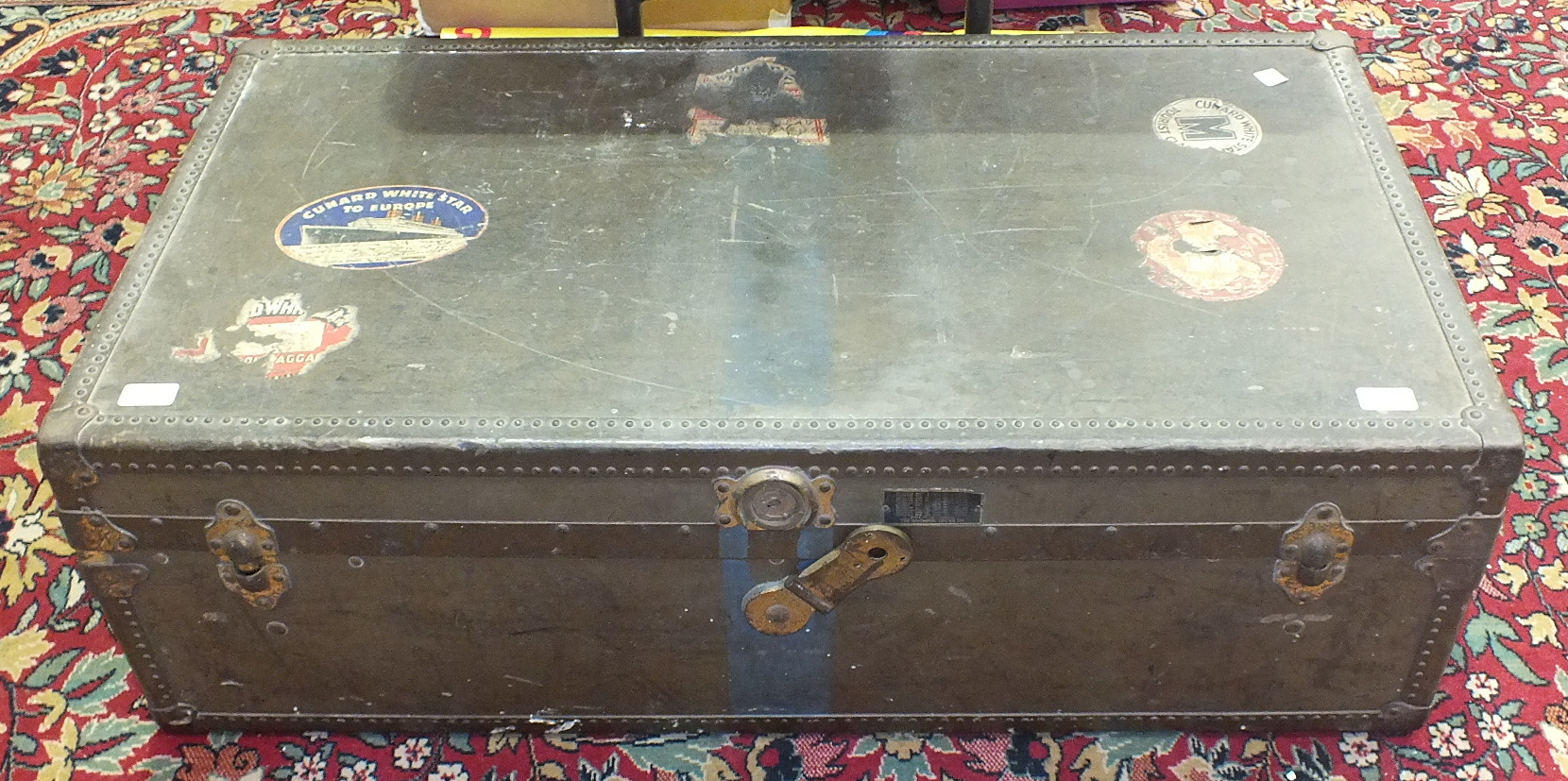 A metal cabin trunk by the Oshkosh Trunk Co. with internal tray, 103cm, applied with Cunard White