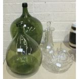 Two green glass carboys, tallest 53cm, a cut-glass jug, 24cm, a similar bowl and a plain glass