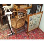 A rush-seated carver chair with bobbin-turned front legs, an elm armchair, two wooden towel rails, a