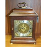 A modern stained mahogany case striking mantel clock, 27cm high, 17cm wide.