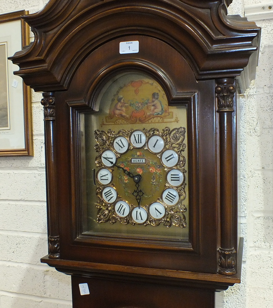 A 20th century mahogany long case clock, the brass dial inscribed Hertz, the movement striking on