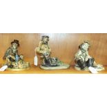 Three Norman Underhill pottery figures, comprising a fisherman, newspaper vendor and a figure seated