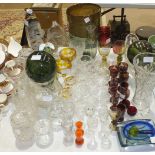 A large collection of glassware, including wine and drinking glasses, vases, decanters, etc.