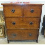 An early-20th century oak chest of two short and two long drawers, with Art-Nouveau-style metal