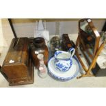 A walnut swing mirror, a C S Universal sewing machine, a willow pattern blue and white ceramic jug