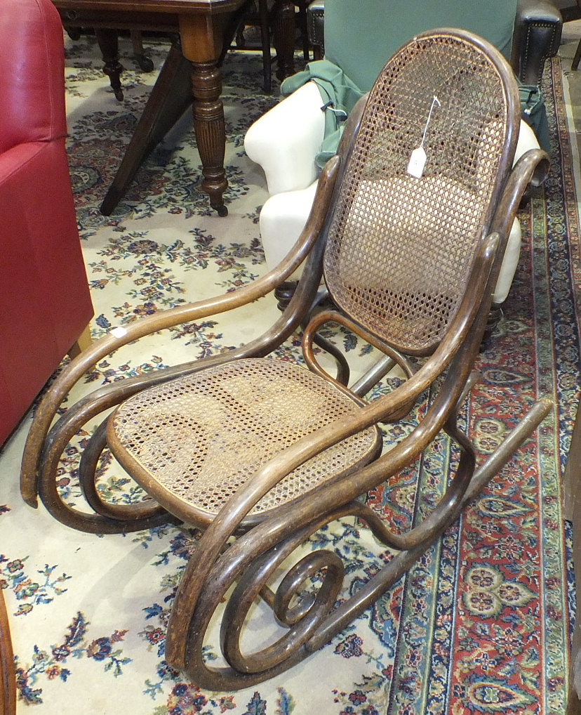 A bentwood caned-back-and-seat rocking chair.