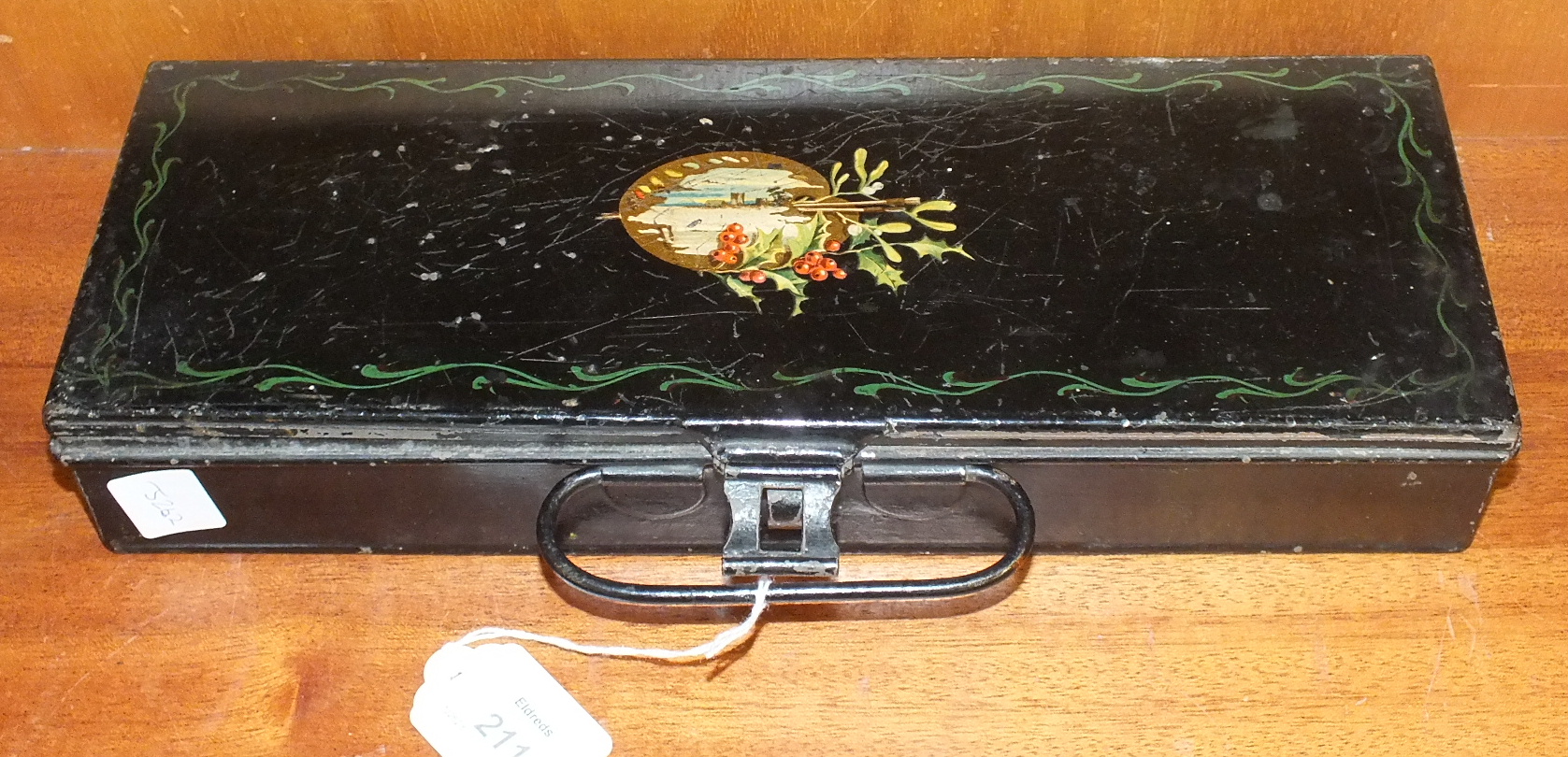 A Roberson & Co. japanned metal artist's paint box, the hinged lid opening to reveal a wooden hinged