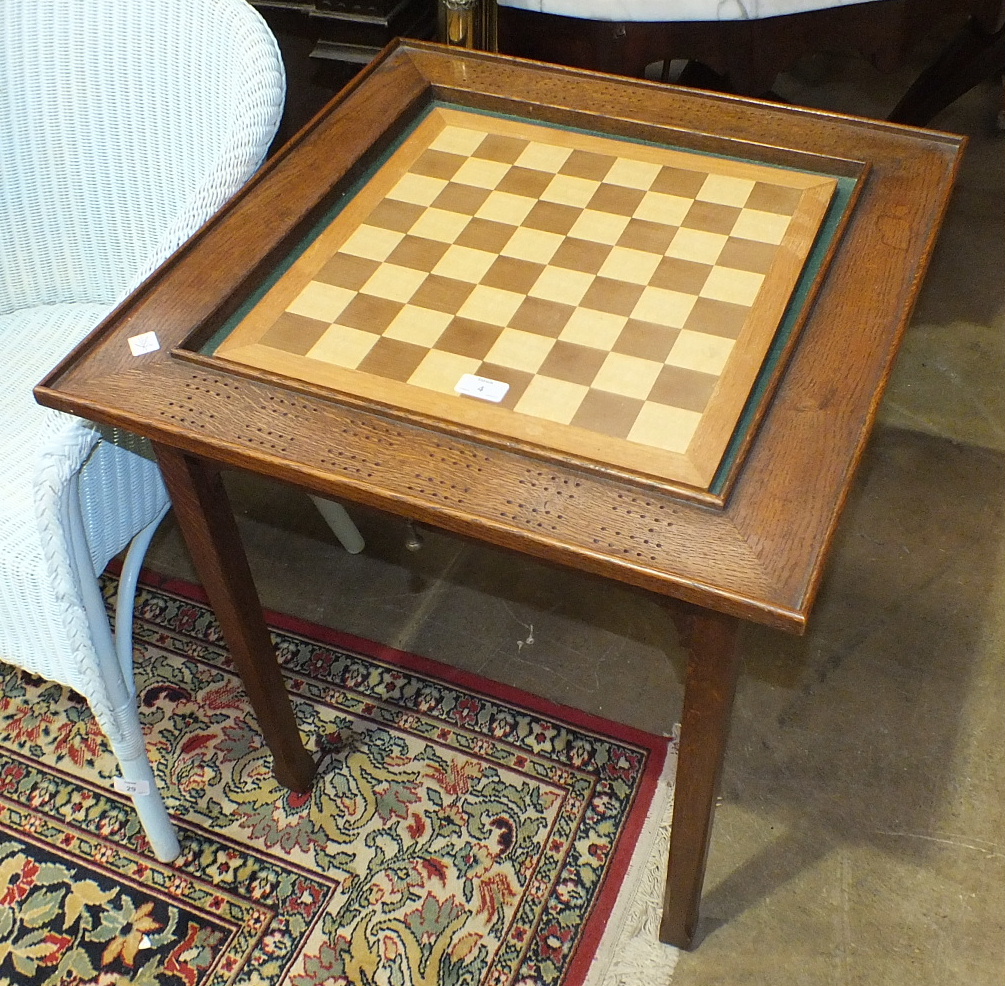 An oak Euchre or Cribbage table with central baize and pierced border score boards, 60cm, a