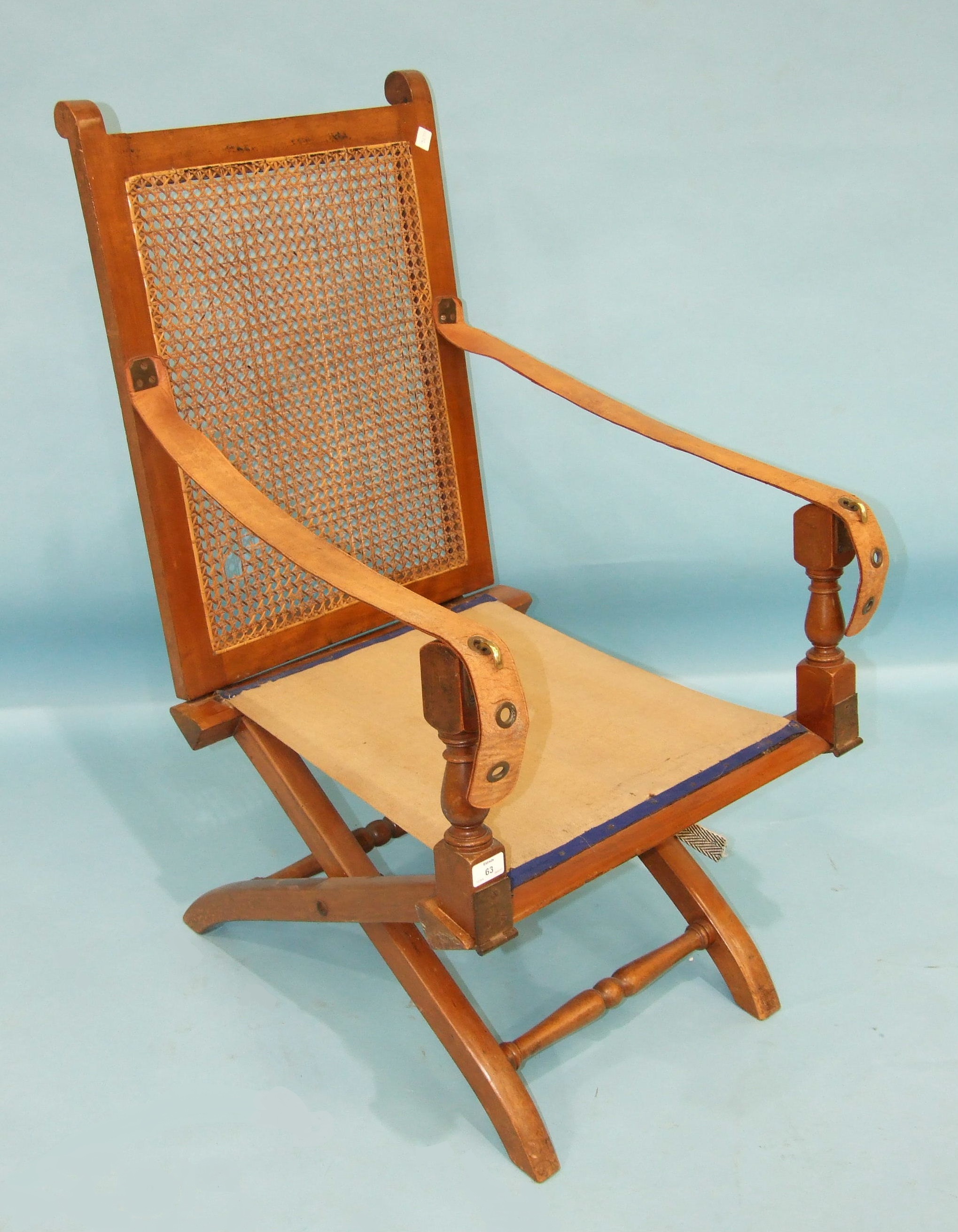 An Edwardian folding campaign chair, the caned back retained by leather-strap arms, on X-frame - Image 2 of 3