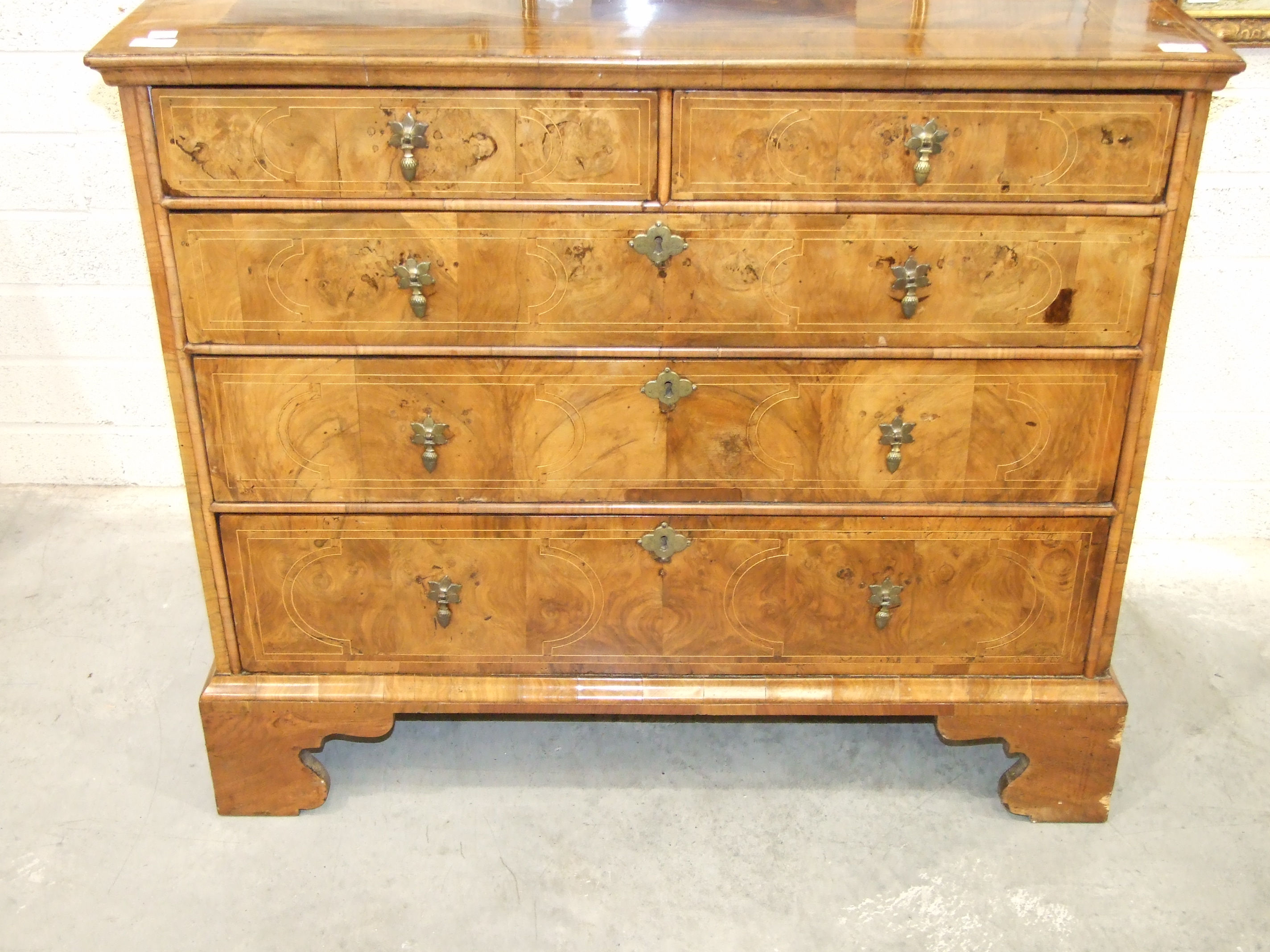 An early-18th century walnut chest, the cross-banded and quarter-veneered top above two short and - Image 2 of 6