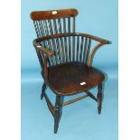 An early-19th century elm and beech small comb-back chair with solid seat, on turned legs joined