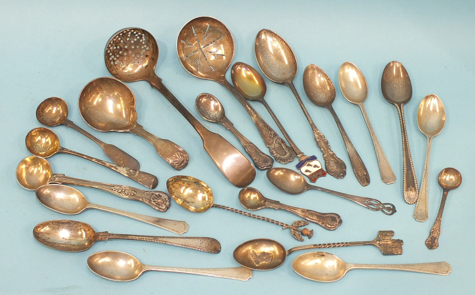 A William IV Scottish fiddle pattern sifter spoon, Edinburgh 1840, a Victorian caddy spoon and other