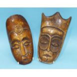 Two antique African bone carved masks, 19cm high, 10cm wide, (2).