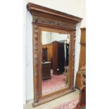 A 19th century Italian large walnut pier mirror, the cornice with foliate, bullet, egg and dart,