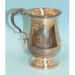 A plain baluster small tankard with leaf-cap scroll handle, 12.5cm, London 1958, ___7.9oz.