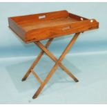 An early-19th century mahogany rectangular butler's tray, the gallery pierced for carrying