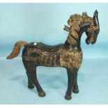 A 20th century Indonesian carved wood model of a horse, with paint and lacquer finish and