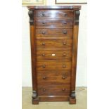 A Victorian mahogany Wellington chest, the hinged top above two false drawers, four other drawers