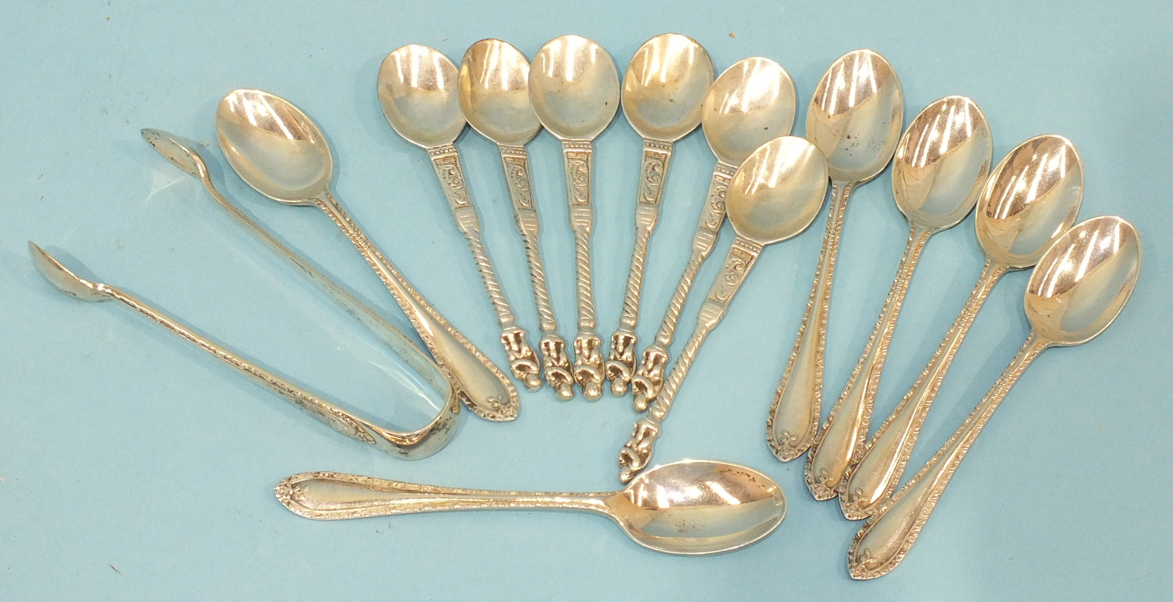 A set of six teaspoons and matching sugar tongs, Sheffield 1931 and a set of six white metal