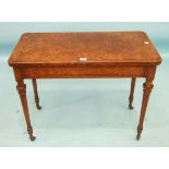 A Victorian burr walnut card table, the rectangular fold-over top and pull-out action on turned