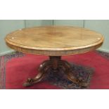 An early-19th century rosewood circular dining table, the top with moulded edge on bulbous carved