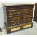 An 18th century Italian chest, the purple marble top (cracked) above a shallow frieze drawer and