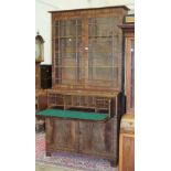 An early-19th century mahogany secretaire bookcase, the upper part with plain cornice above a pair