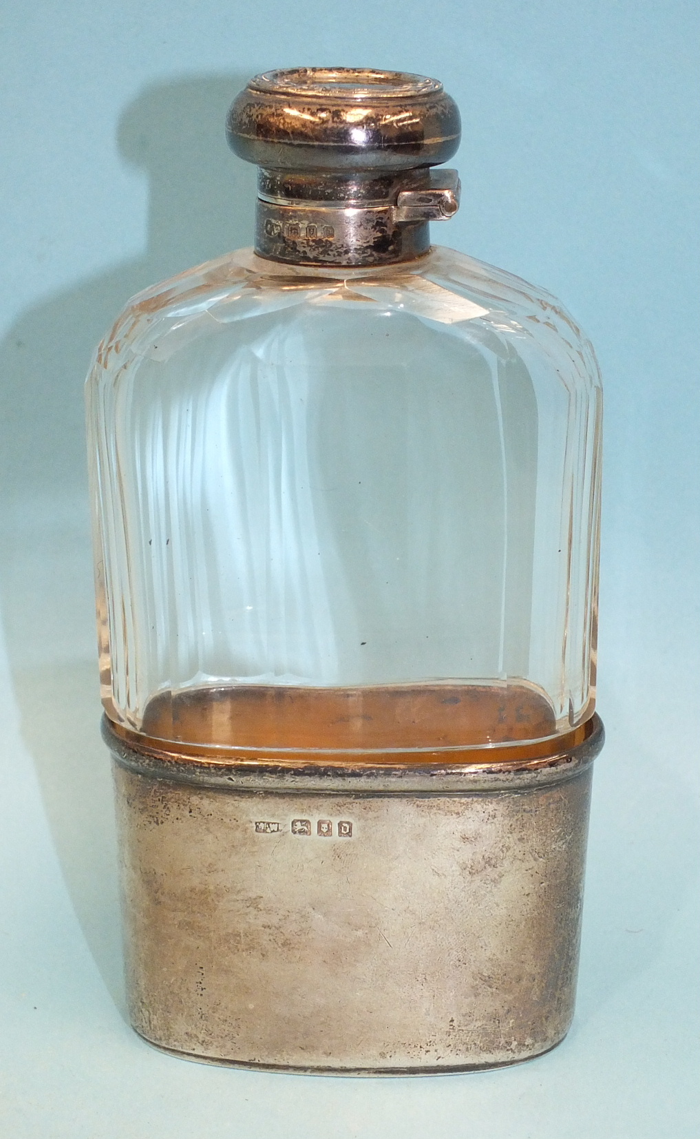 A cut-glass and silver-mounted spirit flask with removable drinking cup by Mappin & Webb, 15cm