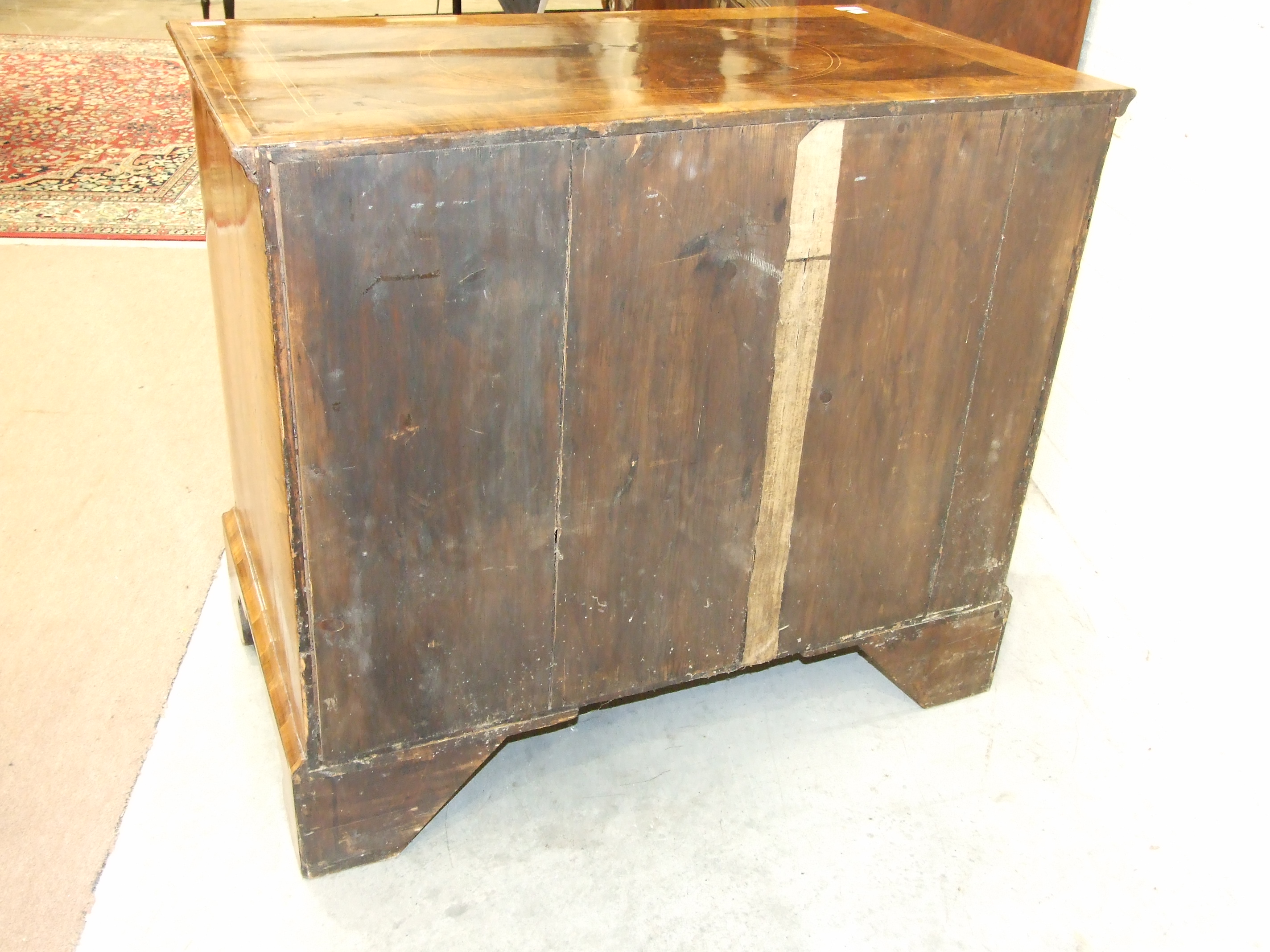 An early-18th century walnut chest, the cross-banded and quarter-veneered top above two short and - Image 6 of 6