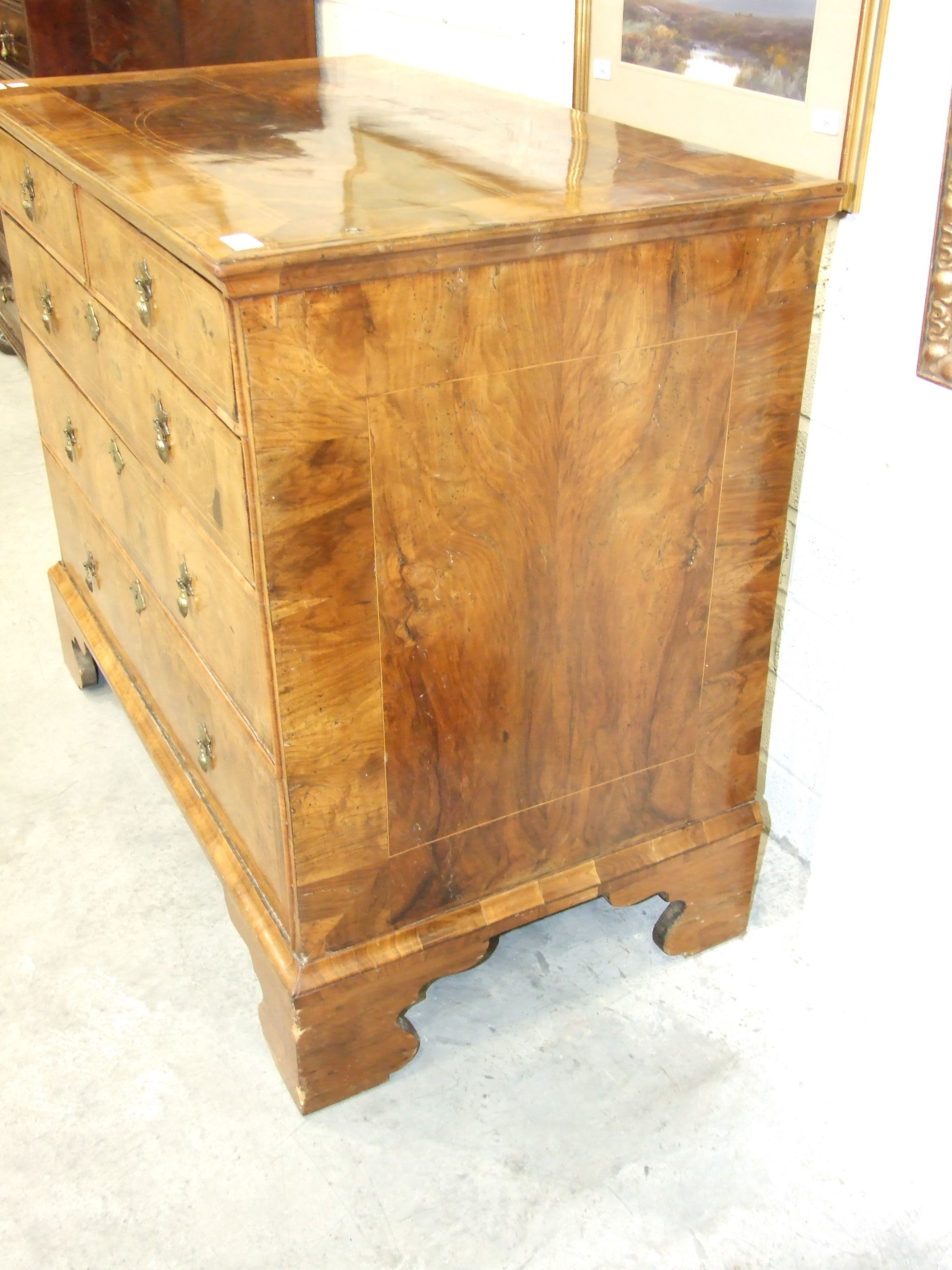 An early-18th century walnut chest, the cross-banded and quarter-veneered top above two short and - Image 4 of 6