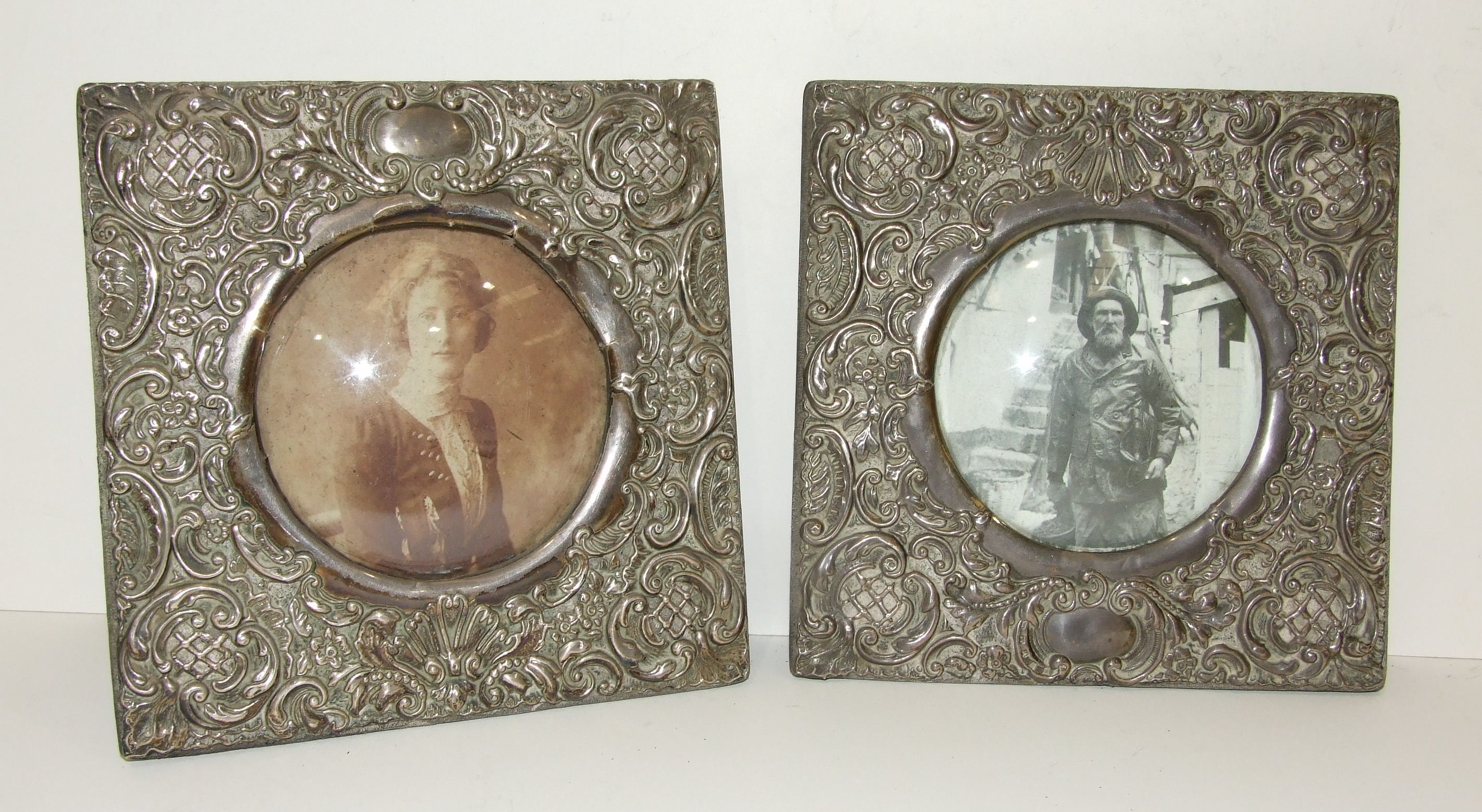 A pair of embossed square photo frames, Birmingham 1902, maker 'SB', 17.5cm square, (strut missing