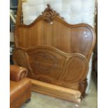 A French carved walnut 4'6" bed with Vi-Spring mattress, complies with 1988 Fire Regulations.