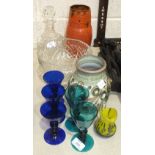 A cut-glass decanter and fruit bowl, five coloured glass drinking glasses and other glass and