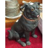 A large pottery model of a pug dog with glass eyes, 35.5cm high (af, repairs to legs).