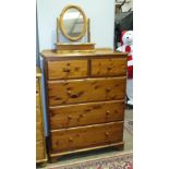 A modern pine chest of two short and three long drawers, 95cm wide, 128cm high and a dressing glass,