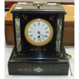 A Victorian black slate and marble mantel clock of architectural form with white enamel dial and