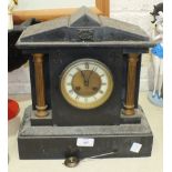 A black slate striking mantel clock of architectural form, the movement stamped Marti, (bell