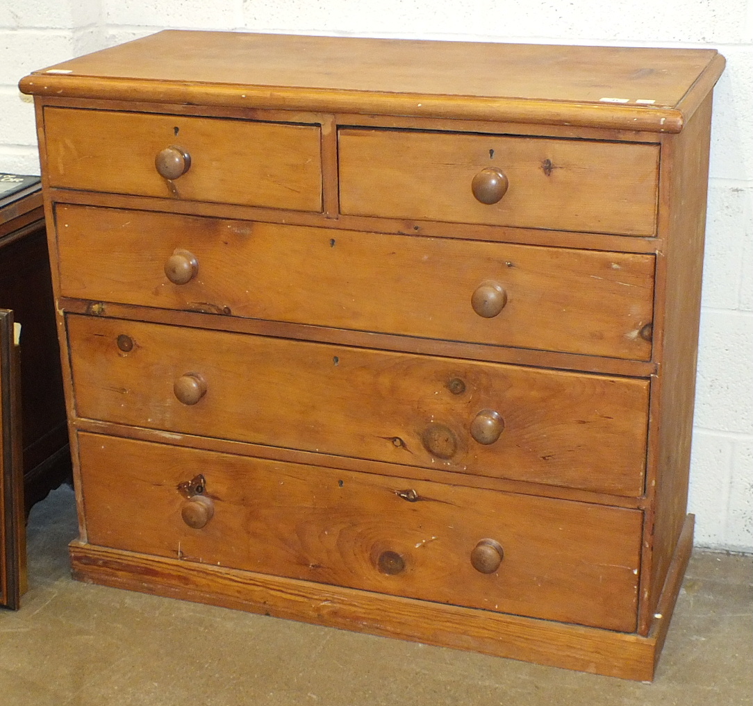 A stripped pine rectangular chest of two short and three long drawers, 104cm wide.