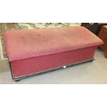 A Victorian oblong upholstered Ottoman box on bun feet, 137cm wide.