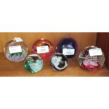 Six Caithness glass paperweights: Fascination, Cauldron x2, Wheel of Fortune, Moon Crystal x 2, (