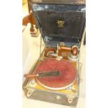 A Dausona portable gramophone, and a collection of 78rpm records.